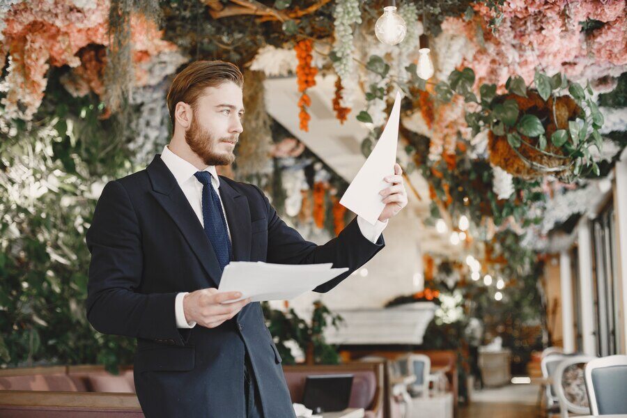 guy-black-suit-male-restaurant_1157-46268