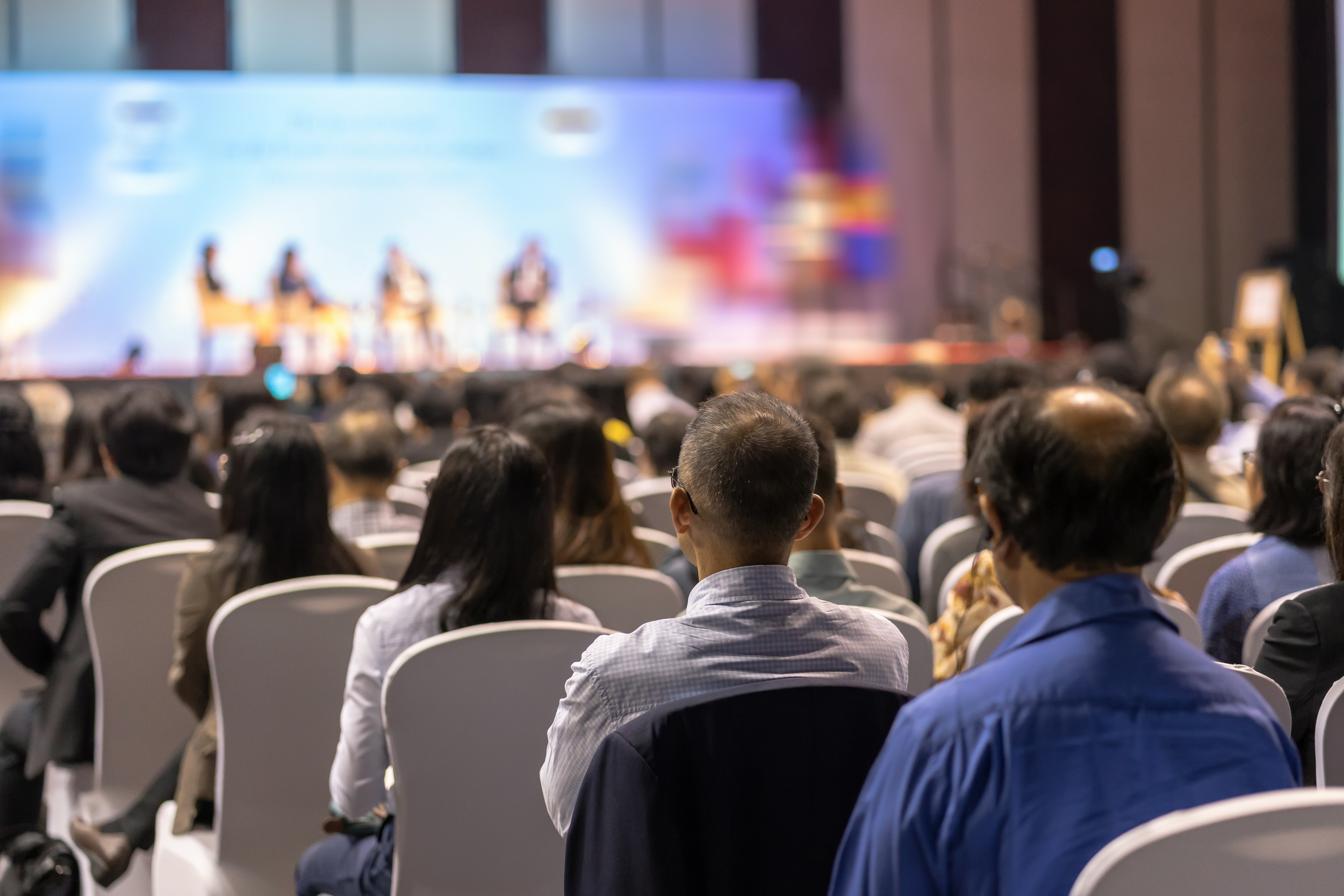 rear-view-audience-listening-conference-jpg