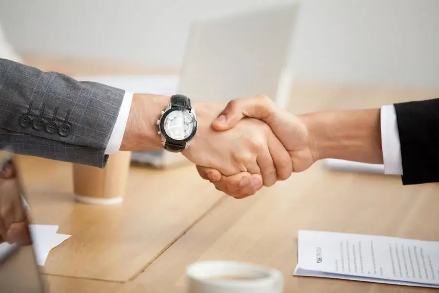 closeup-view-handshake-two-businessmen-suits-shaking-hands (1)